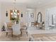 Elegant dining room with a chandelier and seating for six at 4735 Cassio Ct, Bradenton, FL 34211