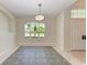 Charming dining room featuring an arched window and tile flooring at 1768 S Creek Ln, Osprey, FL 34229