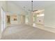 Large living room with high ceilings, an open floor plan, and access to the kitchen at 1768 S Creek Ln, Osprey, FL 34229