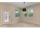 Bright breakfast nook with a view and stylish pendant lighting at 1768 S Creek Ln, Osprey, FL 34229