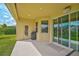 Spacious covered patio with access to backyard and storage at 5514 69Th E Pl, Ellenton, FL 34222