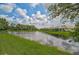 Scenic view of a peaceful lake with beautiful homes along the shoreline at 5514 69Th E Pl, Ellenton, FL 34222