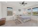 Main bedroom with a king-size bed and plenty of natural light at 5514 69Th E Pl, Ellenton, FL 34222