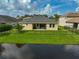 Home with fenced backyard, patio, and water view at 5514 69Th E Pl, Ellenton, FL 34222