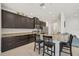 Modern kitchen with granite countertops and stainless steel appliances at 5514 69Th E Pl, Ellenton, FL 34222