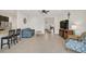 Living room with comfortable seating and a large TV at 5514 69Th E Pl, Ellenton, FL 34222