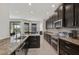 Open concept kitchen with an island and stainless steel appliances at 5514 69Th E Pl, Ellenton, FL 34222