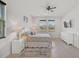 Large bedroom with king bed, dresser, and window views at 5514 69Th E Pl, Ellenton, FL 34222
