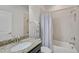 Clean bathroom with granite vanity, shower, and bathtub at 5514 69Th E Pl, Ellenton, FL 34222