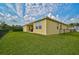 House exterior showcasing well-manicured lawn and backyard at 5514 69Th E Pl, Ellenton, FL 34222
