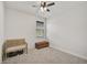 Simple bedroom with carpeted floor, a bench and a wooden chest at 5514 69Th E Pl, Ellenton, FL 34222