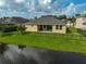 Home with fenced backyard, patio, and water view at 5514 69Th E Pl, Ellenton, FL 34222