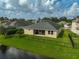 Home with fenced backyard, patio, and water view at 5514 69Th E Pl, Ellenton, FL 34222