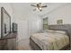 Bright bedroom featuring a comfortable bed and ample closet space at 5514 69Th E Pl, Ellenton, FL 34222