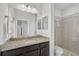 Bathroom with granite vanity, mirror, and shower at 5514 69Th E Pl, Ellenton, FL 34222