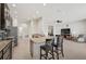 Open kitchen with island, granite countertops, and stainless steel appliances at 5514 69Th E Pl, Ellenton, FL 34222