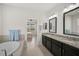 Main bathroom with double vanity and access to bedroom at 5514 69Th E Pl, Ellenton, FL 34222