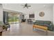 Open living area with tile floors, sliding glass doors, and access to the backyard at 5514 69Th E Pl, Ellenton, FL 34222