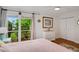Bedroom with garden views and ample closet space at 3413 Clark Rd # 114, Sarasota, FL 34231
