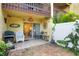 Private patio with grill and access to living room at 3413 Clark Rd # 114, Sarasota, FL 34231