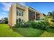 Building exterior with landscaping and grassy area at 3413 Clark Rd # 114, Sarasota, FL 34231