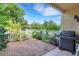 Brick paved patio with grill and fenced yard at 3413 Clark Rd # 114, Sarasota, FL 34231