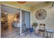 Private patio with seating and view of living room at 3413 Clark Rd # 114, Sarasota, FL 34231