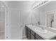 Shared bathroom with double vanity and updated finishes at 4821 Silver Topaz St, Sarasota, FL 34233