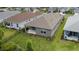 Rear view of house showing patio and landscaping at 3705 Woodmont Dr, Parrish, FL 34219