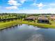 Aerial view of lakefront home with preserve views at 4735 Cassio Ct, Bradenton, FL 34211