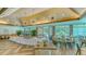Elegant dining room with large windows and modern chandeliers at 7217 Churston Ln, University Park, FL 34201