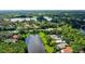 An aerial view of a house nestled in a quiet community by the lake at 7217 Churston Ln, University Park, FL 34201