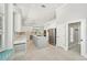 Bright, airy kitchen featuring an island cooktop, stainless appliances, and a light, neutral color palette at 7217 Churston Ln, University Park, FL 34201