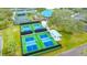 Aerial view of pickleball courts near tennis courts and clubhouse at 7217 Churston Ln, University Park, FL 34201