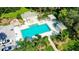 Community pool with pergola, lounge chairs, and cabana at 7217 Churston Ln, University Park, FL 34201