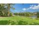 Serene waterfront view with lush greenery and a peaceful atmosphere at 7217 Churston Ln, University Park, FL 34201