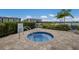 Relaxing community hot tub with surrounding patio at 10748 Klee Ave, Bradenton, FL 34212