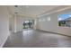 Spacious living room with tile floors and access to the pool area at 10748 Klee Ave, Bradenton, FL 34212