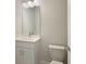 Small bathroom with white vanity, toilet and mirror at 10748 Klee Ave, Bradenton, FL 34212