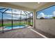 Screened pool area with paver deck and backyard view at 10748 Klee Ave, Bradenton, FL 34212