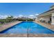 Inviting community pool with lounge chairs and patio tables at 10748 Klee Ave, Bradenton, FL 34212