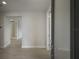 Bright and airy entryway with tile floors and multiple doors at 10748 Klee Ave, Bradenton, FL 34212