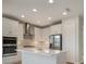 Modern kitchen with white cabinets, stainless steel appliances, and an island at 10748 Klee Ave, Bradenton, FL 34212