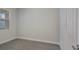 Simple bedroom with a window, wood-look tile floor, and neutral walls at 10748 Klee Ave, Bradenton, FL 34212