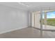 Living room with tile floors and sliding glass doors to balcony at 393 N Point Rd # 503, Osprey, FL 34229