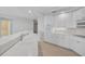 White kitchen with ample counter space and stainless steel appliances at 393 N Point Rd # 503, Osprey, FL 34229