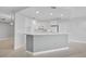 Modern kitchen featuring white cabinetry and a breakfast bar at 393 N Point Rd # 503, Osprey, FL 34229
