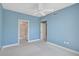Bedroom with bathroom access and ceiling fan at 393 N Point Rd # 503, Osprey, FL 34229