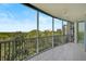 Spacious balcony overlooking lush landscape and water at 393 N Point Rd # 503, Osprey, FL 34229