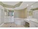 Elegant bathroom featuring a large bathtub and double vanity at 393 N Point Rd # 503, Osprey, FL 34229